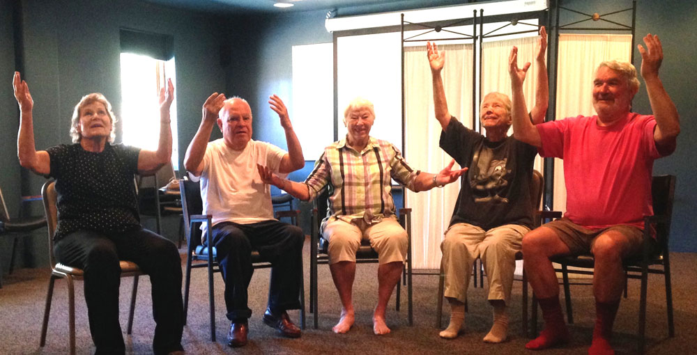 A ROM Dance® Class demonstrates  Bathing Me in a Shining Light movement