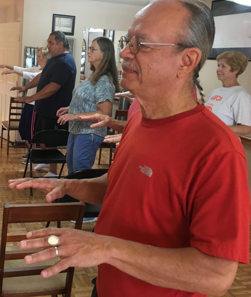 Instructor Frank Gonzales and class practice Basic Move: Bear Roots on One Leg